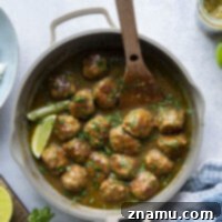 These green curry chicken meatballs feature tender chicken meatballs simmered in the most amazing gingery green curry sauce. Serve over a pile of hot rice with lots of fresh cilantro and lime!