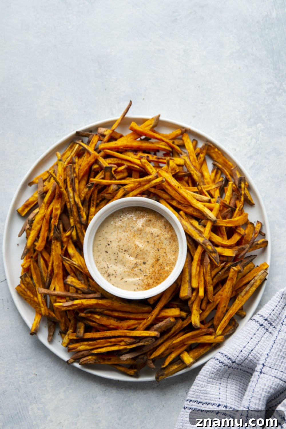 Crispy Air Fryer Sweet Potato Fries with Creamy Chipotle Aioli 5 Uniformly cut sweet potato fries ready for air frying