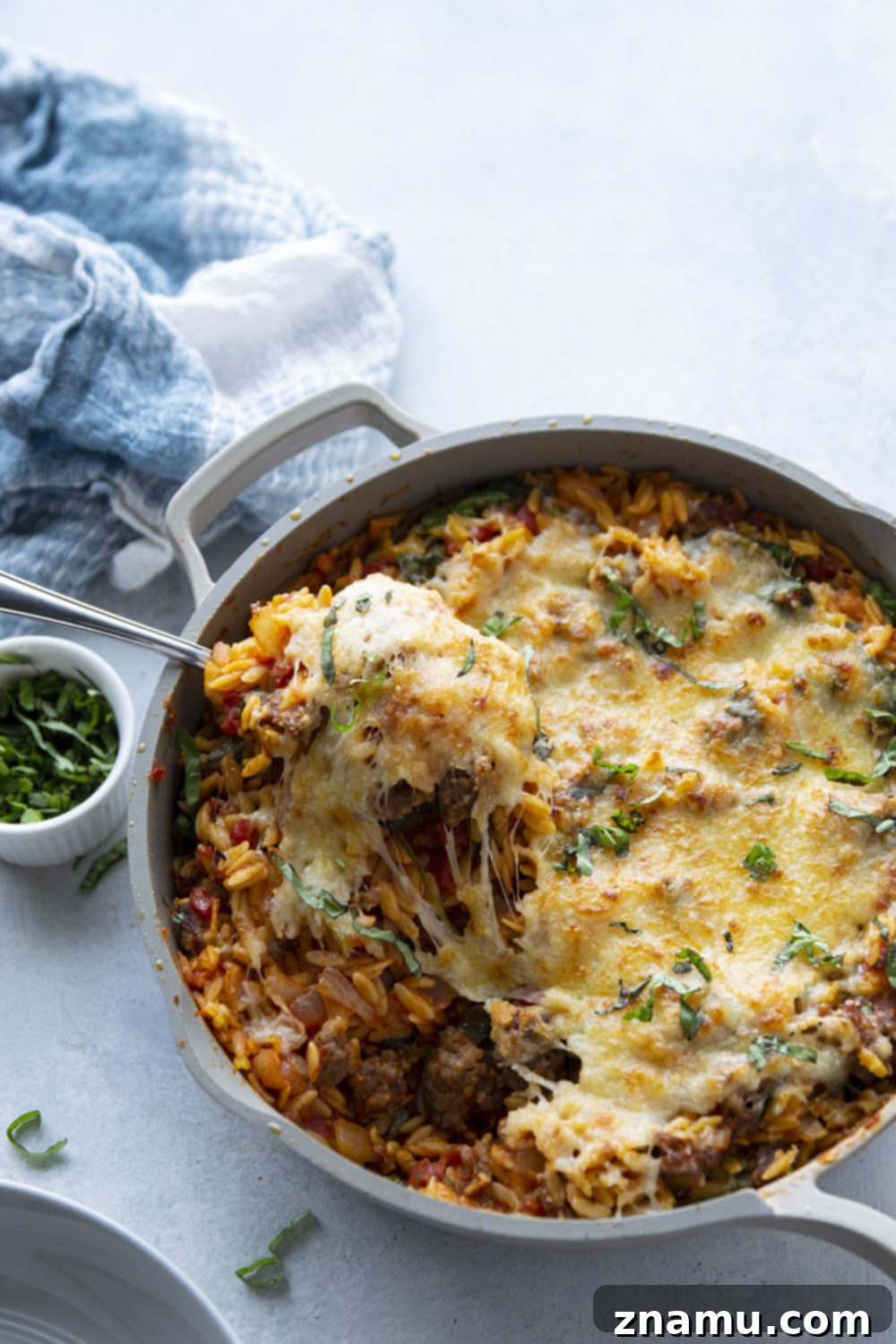 Made entirely in one pot, this Italian sausage orzo is packed full of tender orzo, flavorful sausage bits, and lots of gooey cheese. - on the table in 40 minutes and perfect for a weeknight!