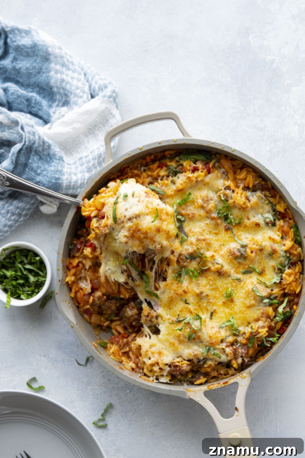 Made entirely in one pot, this Italian sausage orzo is packed full of tender orzo, flavorful sausage bits, and lots of gooey cheese. - on the table in 40 minutes and perfect for a weeknight!