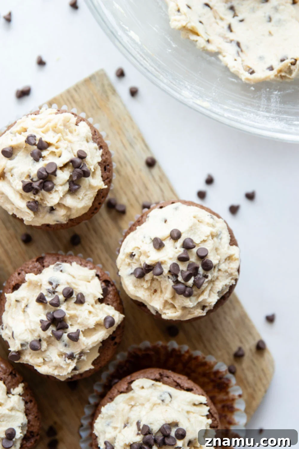Ultimate Cookie Dough Brownie Cupcakes 4 A batch of freshly baked brownie cupcakes with heat-treated flour ready for frosting.