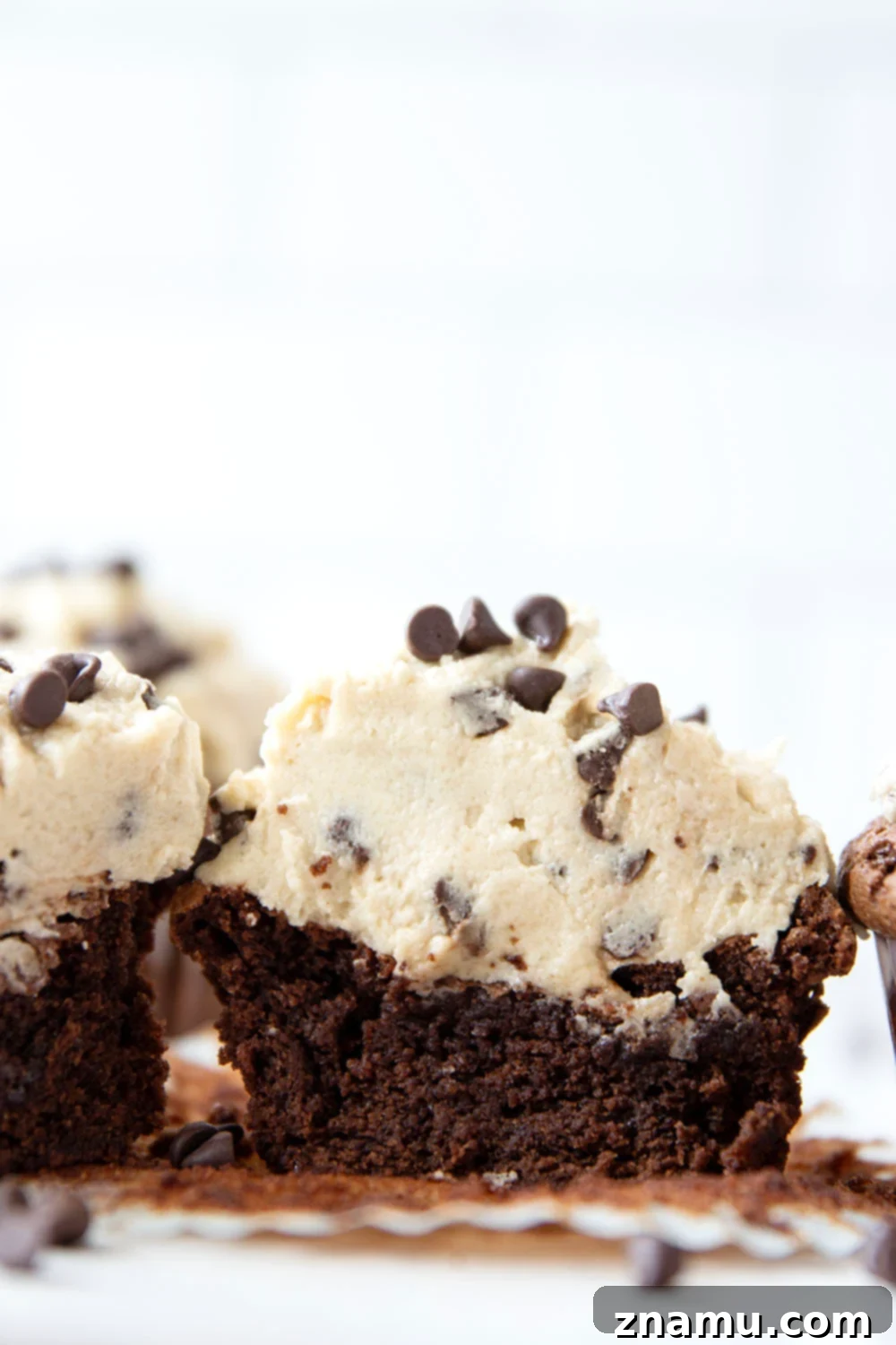 Ultimate Cookie Dough Brownie Cupcakes 5 Delicious brownie cupcakes before frosting, showing their perfect fudgy texture and rich brown color.
