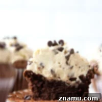 Fudgy brownie cupcakes are frosted with a rich and creamy cookie dough frosting.