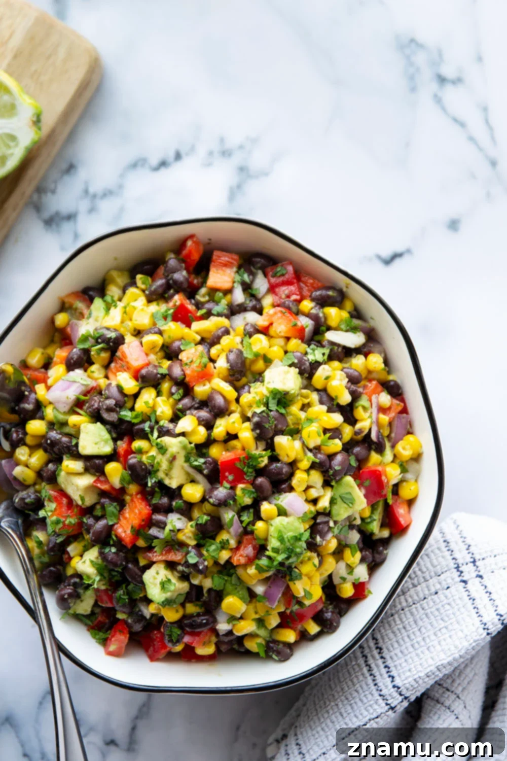 Vibrant Black Bean Corn Fiesta with Jalapeño Zing 3 Close-up of a fresh Mexican Black Bean Corn Salad, showcasing its colorful ingredients like black beans, corn, red onion, and cilantro.