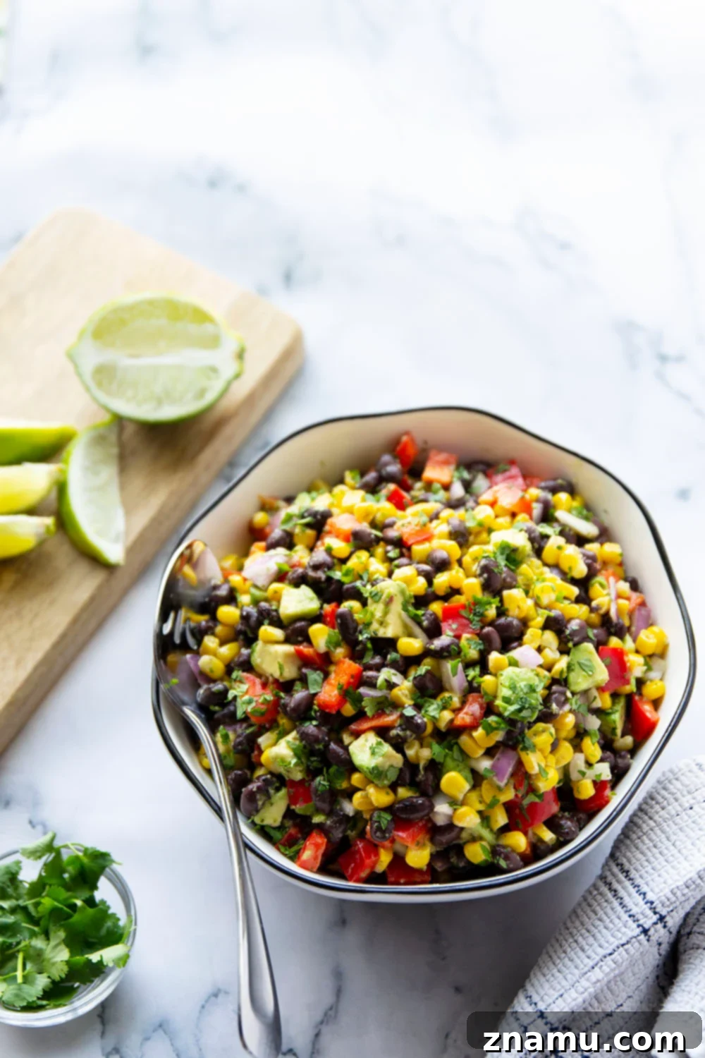 Vibrant Black Bean Corn Fiesta with Jalapeño Zing 6 Large bowl of Mexican Black Bean Corn Salad, ready to be served, with vibrant colors.