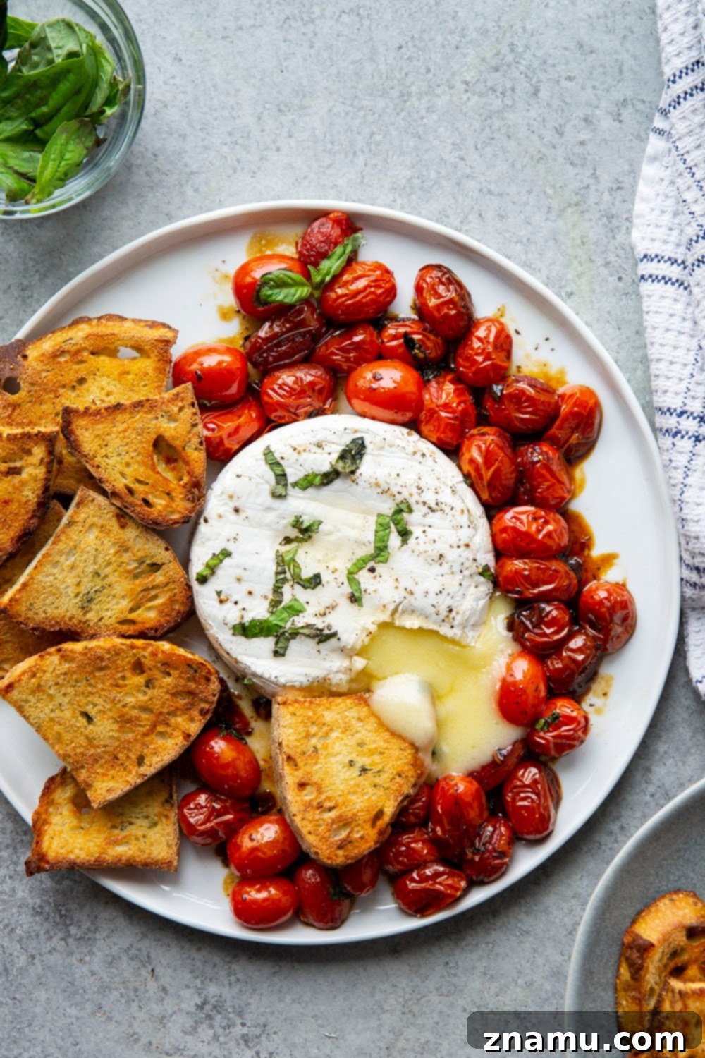 Baked Brie with Roasted Cherry Tomatoes and Fresh Herbs 2 Perfectly melty and herb-topped baked brie with cherry tomatoes, a super easy appetizer served with crostini.