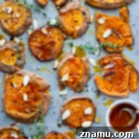 Perfectly crispy smashed sweet potatoes are drizzled with a flavorful hot honey butter sauce and the easiest weeknight side dish that goes with anything!