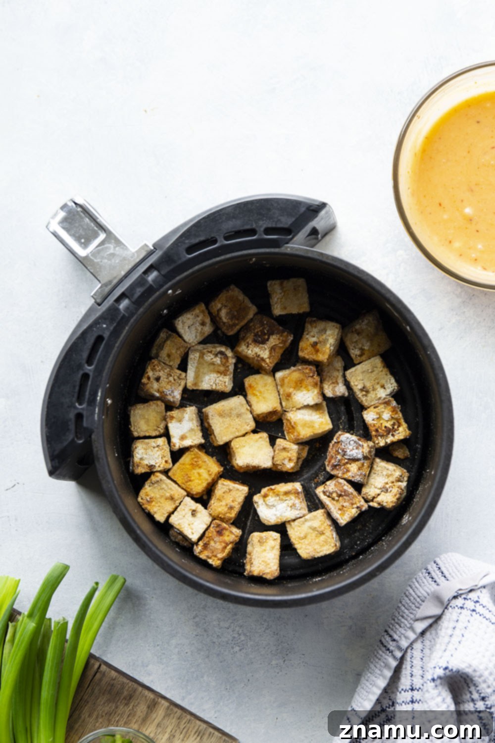 Crispy Air Fryer Bang Bang Tofu 5 Pressed tofu cut into cubes, ready for seasoning and air frying