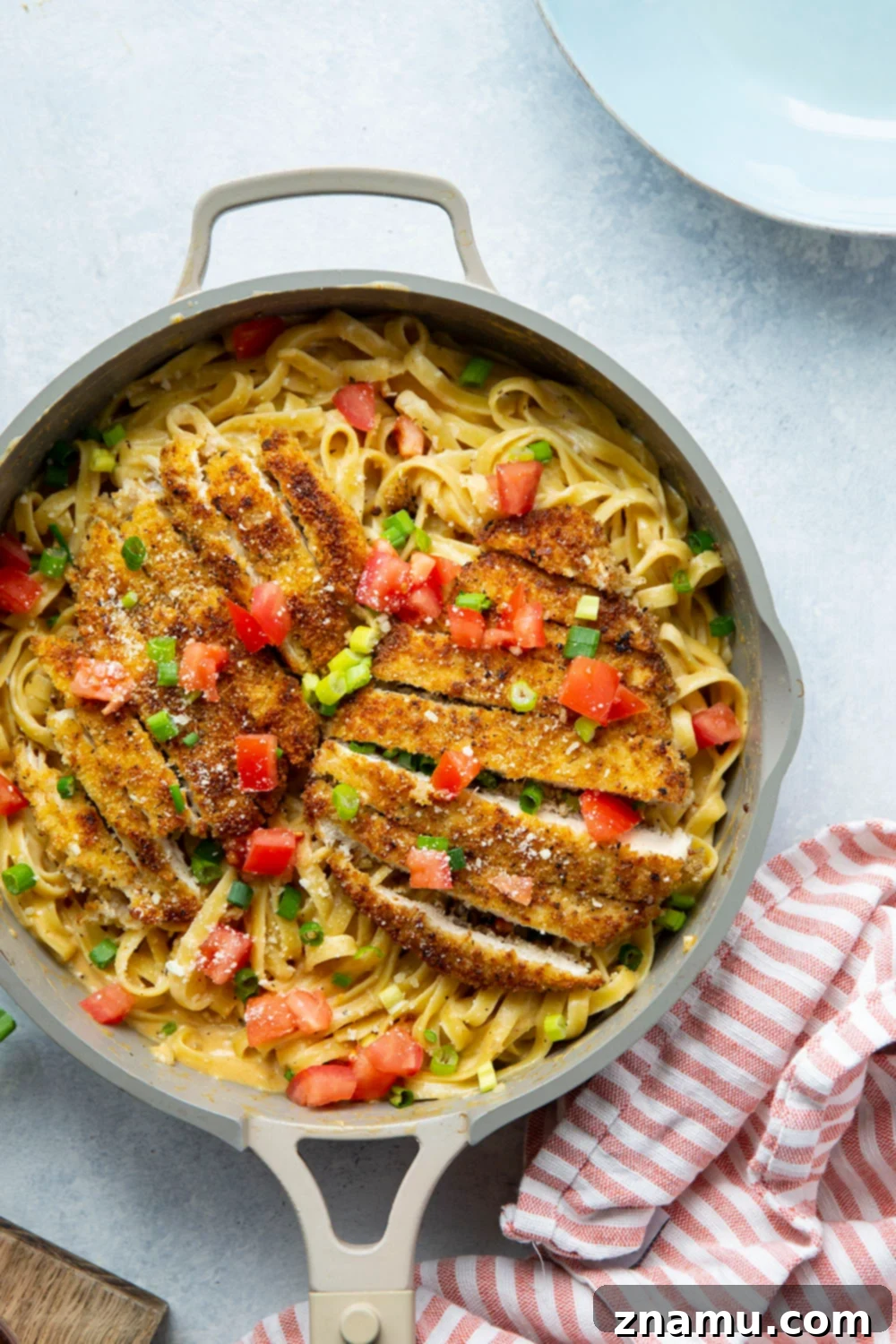 Golden Crispy Cajun Chicken Alfredo 2 Crispy cajun breaded chicken cutlets and creamy fettuccine alfredo are the perfect duo in this flavor-packed cajun chicken fettuccine alfredo that's sure to become a weeknight regular!