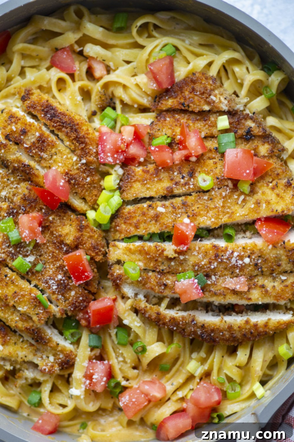 Golden Crispy Cajun Chicken Alfredo 4 Crispy cajun breaded chicken cutlets and creamy fettuccine alfredo are the perfect duo in this flavor-packed cajun chicken fettuccine alfredo that's sure to become a weeknight regular!