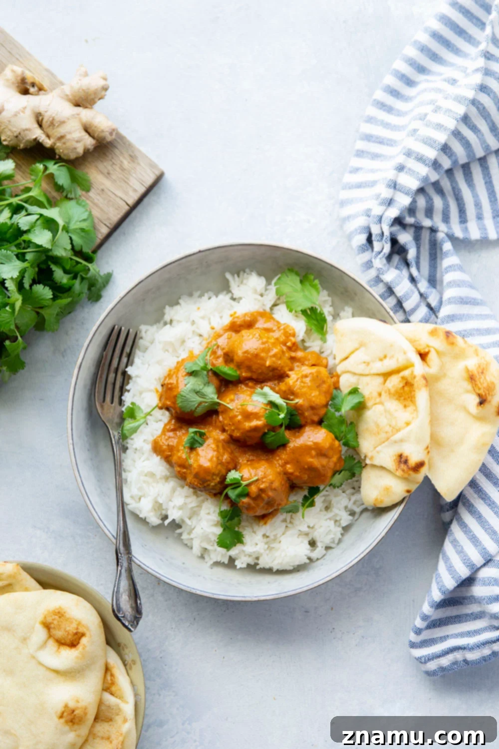 Creamy Instant Pot Butter Chicken Meatballs 2 Instant Pot Butter Chicken Meatballs: Tender chicken meatballs smothered in a rich, creamy curry sauce, made entirely in the Instant Pot for a quick and flavorful meal. Served with basmati rice, cilantro, and naan.