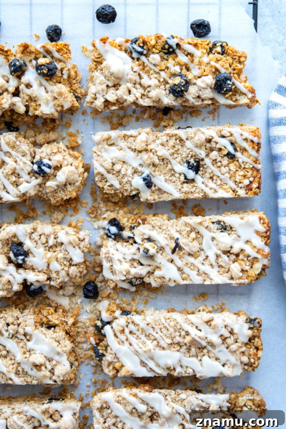 Blueberry Muffin Crunch Bars 4 Close-up of a blueberry muffin granola bar revealing the chewy texture, blueberries, and streusel