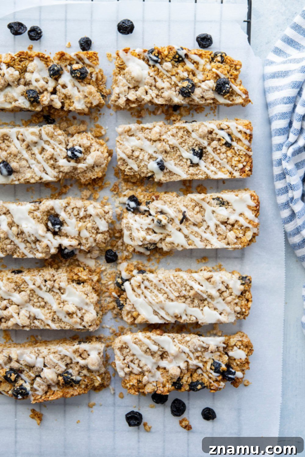Blueberry Muffin Crunch Bars 6 A stack of blueberry muffin granola bars with visible streusel and glaze
