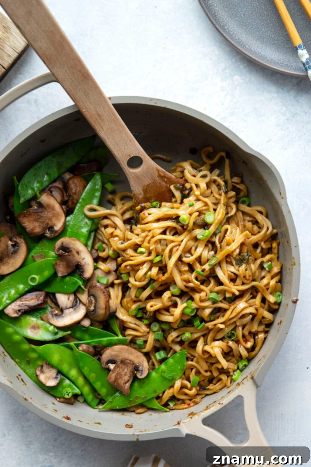 Fiery Miso Scallion Noodles 5 A vibrant bowl of spicy scallion miso noodles, garnished with extra green onions and chili flakes, ready to be served.