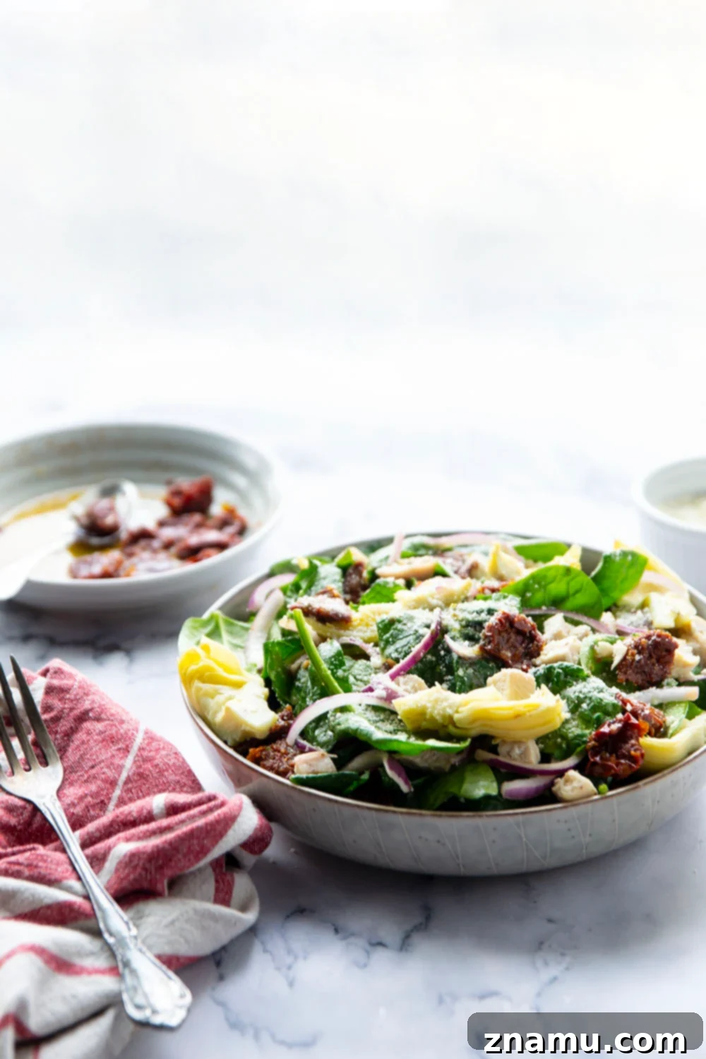 Sun-Kissed Tuscan Chicken & Spinach Salad 6 Prepared Sun-Dried Tomato Spinach Chicken Salad in a serving bowl