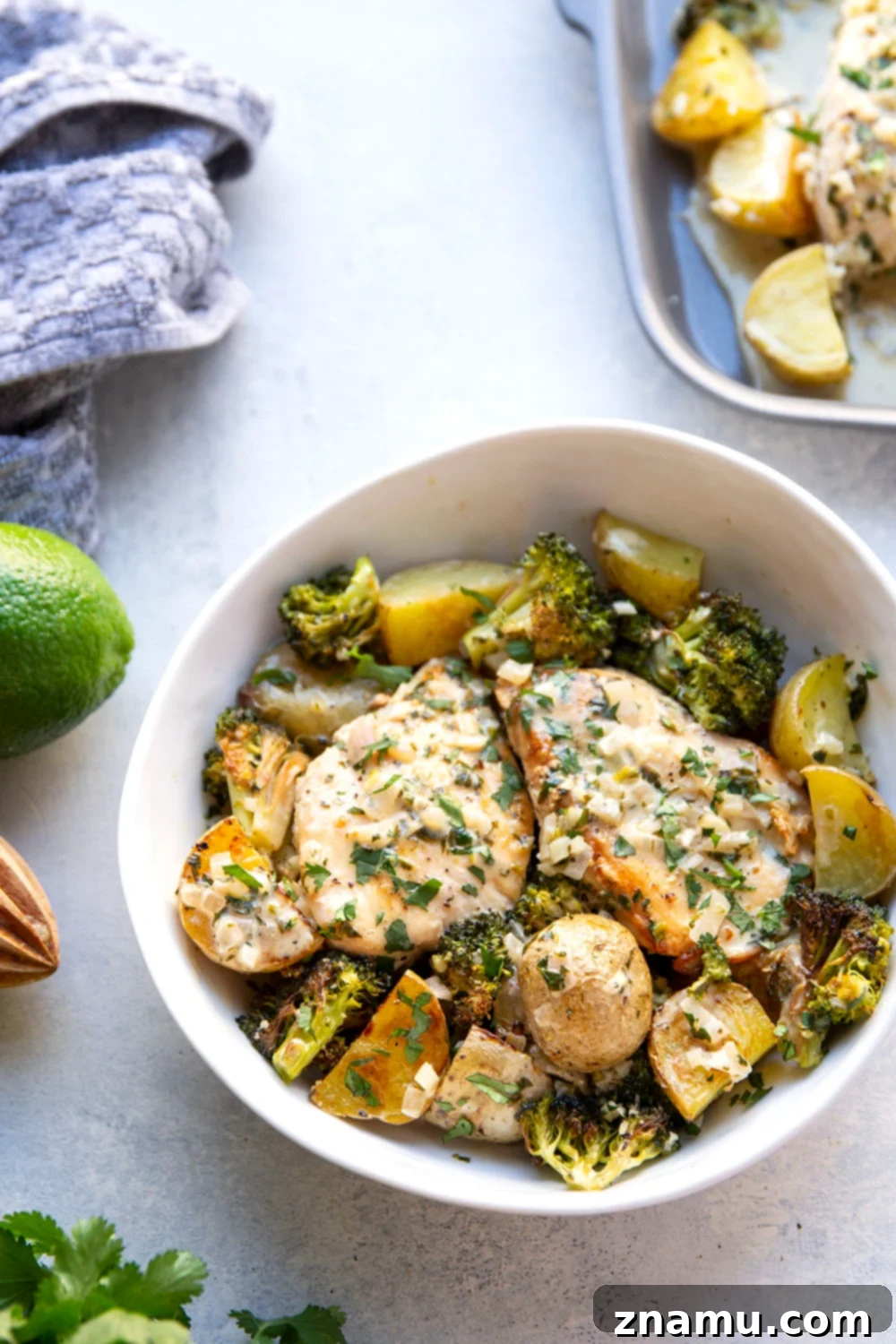 Flavorful Cilantro Lime Chicken & Roasted Veggies 6 Finished creamy cilantro lime chicken with potatoes and broccoli on a sheet pan.
