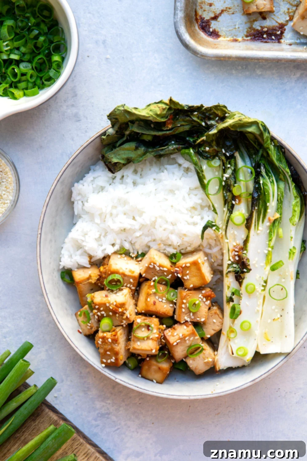 Savory Miso Tofu with Crisp Bok Choy 4 This miso baked tofu features tofu cubes marinated in a flavorful miso sauce and roasted alongside tender bok choy on one sheet pan. Serve this tofu and bok choy over hot rice with lots of sesame seeds and scallions!