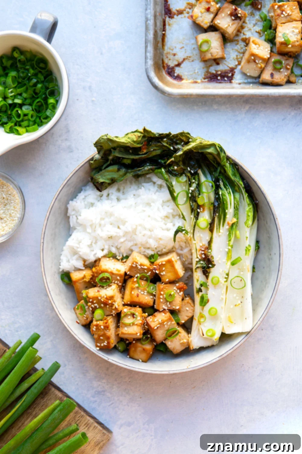 Savory Miso Tofu with Crisp Bok Choy 6 This miso baked tofu features tofu cubes marinated in a flavorful miso sauce and roasted alongside tender bok choy on one sheet pan. Serve this tofu and bok choy over hot rice with lots of sesame seeds and scallions!