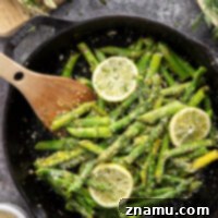Tender asparagus is cooked on the stovetop with garlic, dill, and lots of fresh lemon in this easy sautéed lemon garlic asparagus!