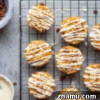 Packed with all the best parts of a classic carrot cake, these carrot cake baked oatmeal cups are an easy, filling breakfast and the prettiest addition to any brunch!