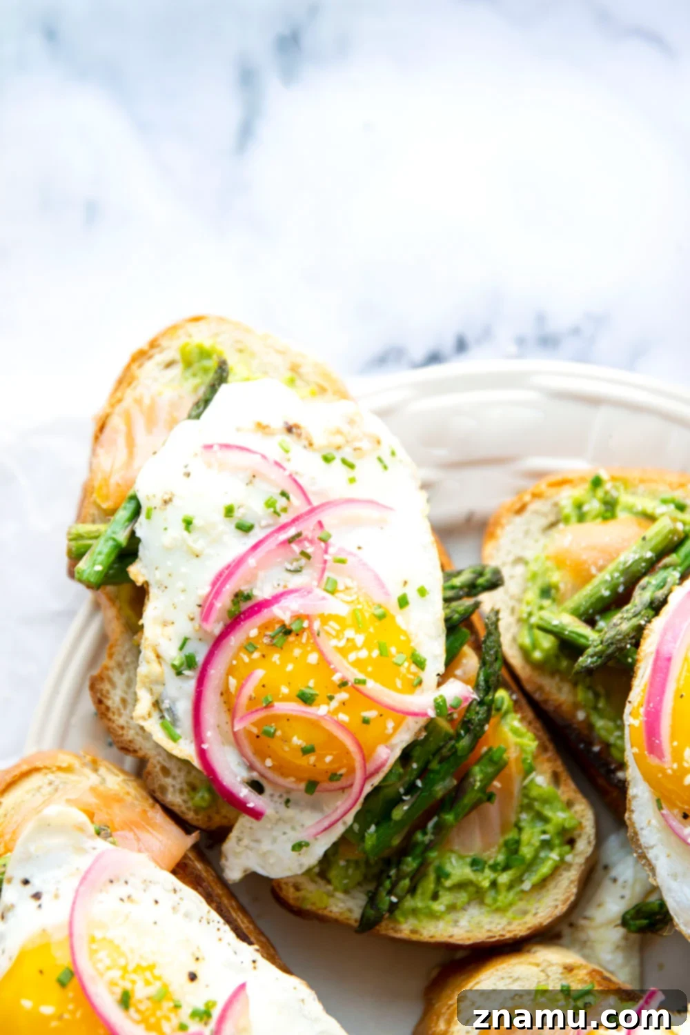 Elevated Smoked Salmon, Asparagus & Avocado Toast 5 Flavorful smoked salmon, creamy avocado, and tender asparagus join forces in this smoked salmon avocado toast that's both impressive and quick to make!