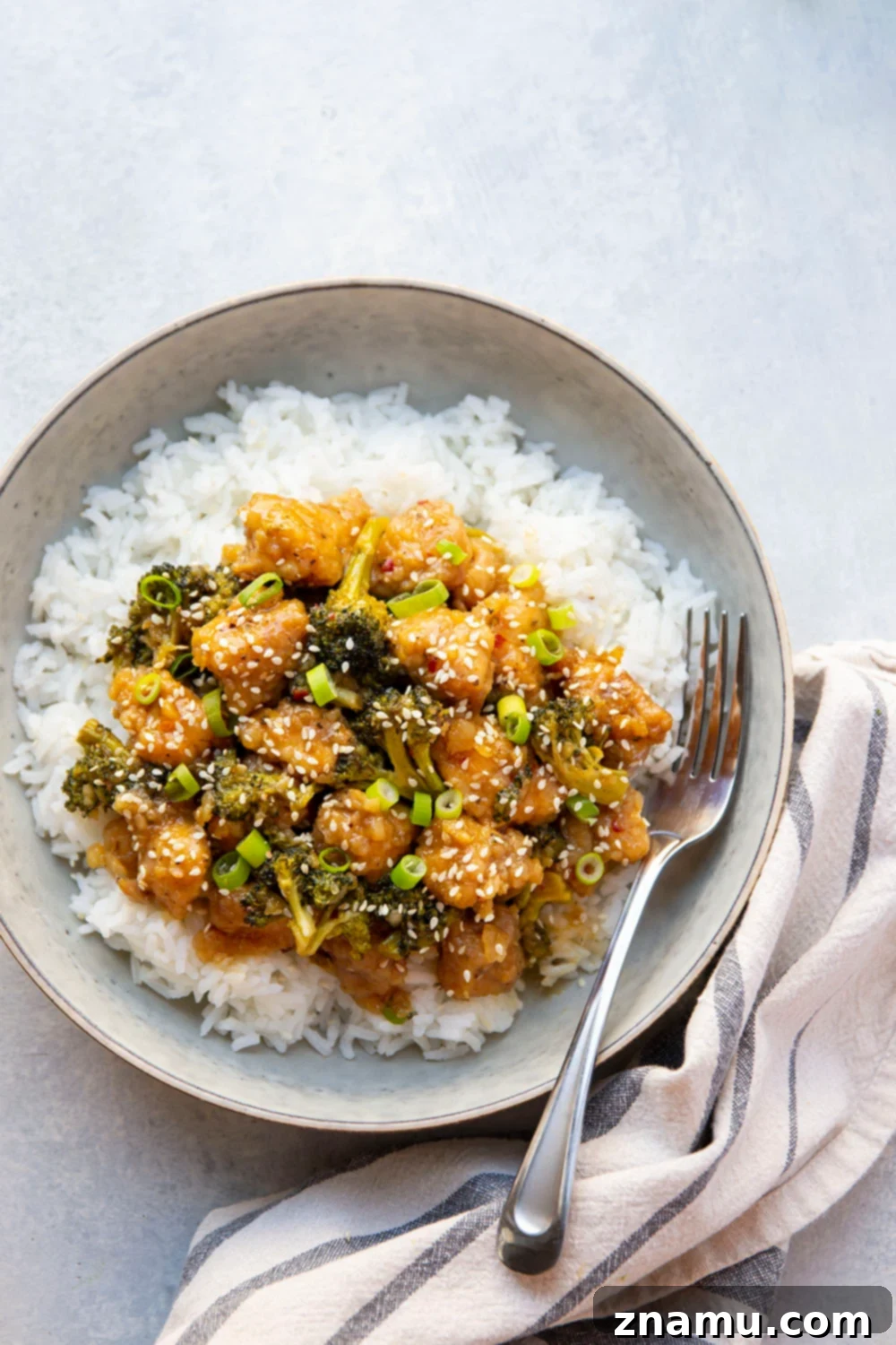 Sticky Honey Bourbon Chicken and Broccoli 3 Honey Bourbon Chicken and Broccoli cooking in a skillet, showcasing the rich sauce and vibrant ingredients.