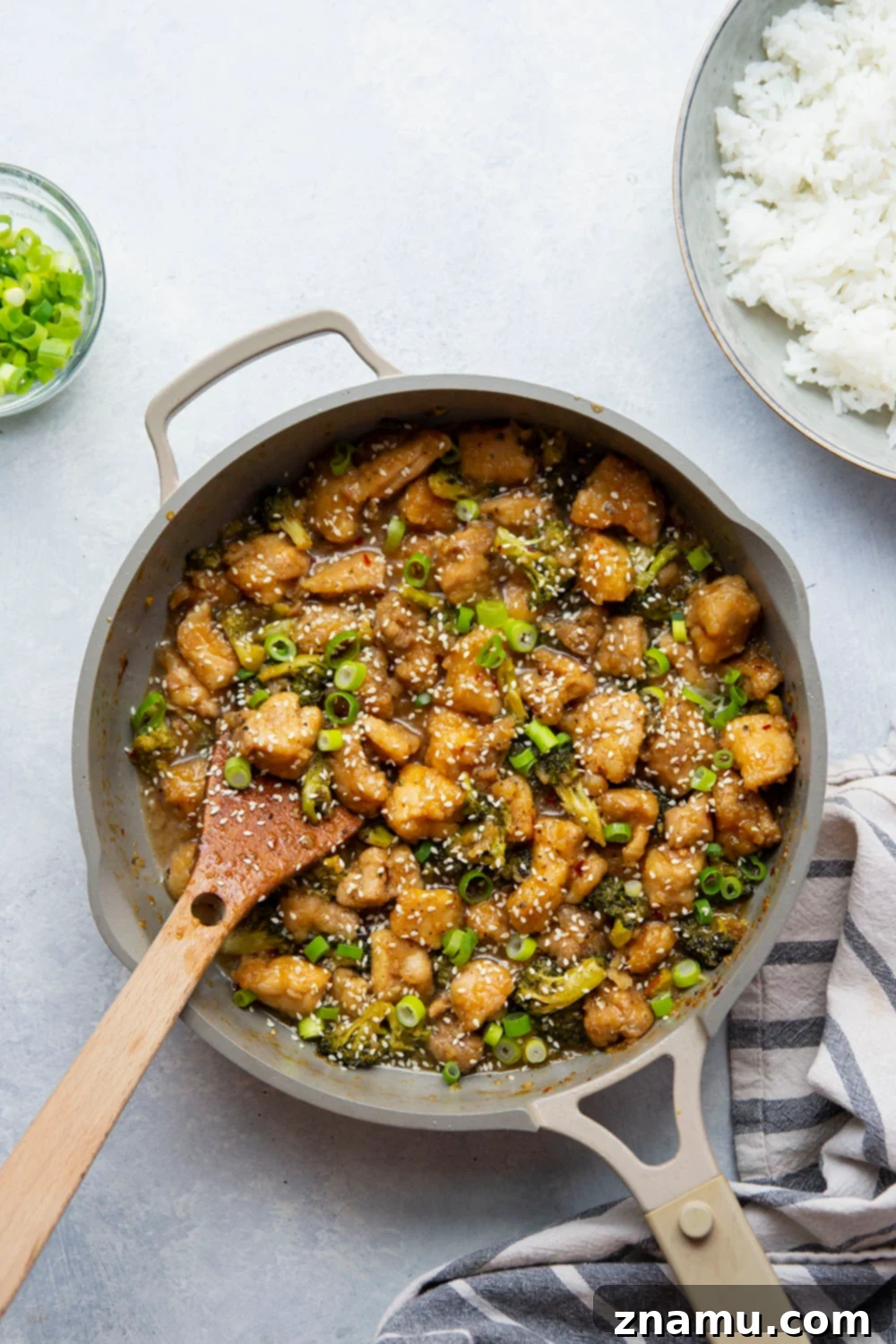 Sticky Honey Bourbon Chicken and Broccoli 4 Detailed shot of breaded chicken cubes cooking in a hot skillet, golden brown and ready for the bourbon sauce.
