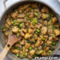 Sticky Honey Bourbon Chicken and Broccoli 8 This honey bourbon chicken features juicy coated chicken and tender broccoli in the most incredible honey bourbon sauce! Serve this hearty chicken over hot rice with lots of green onions and sesame seeds on top.