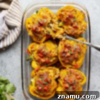 Stuffed with all the best parts about a cheesy chicken enchilada, these chicken enchilada stuffed peppers are easy to make and amazing loaded up with all your favorite toppings!