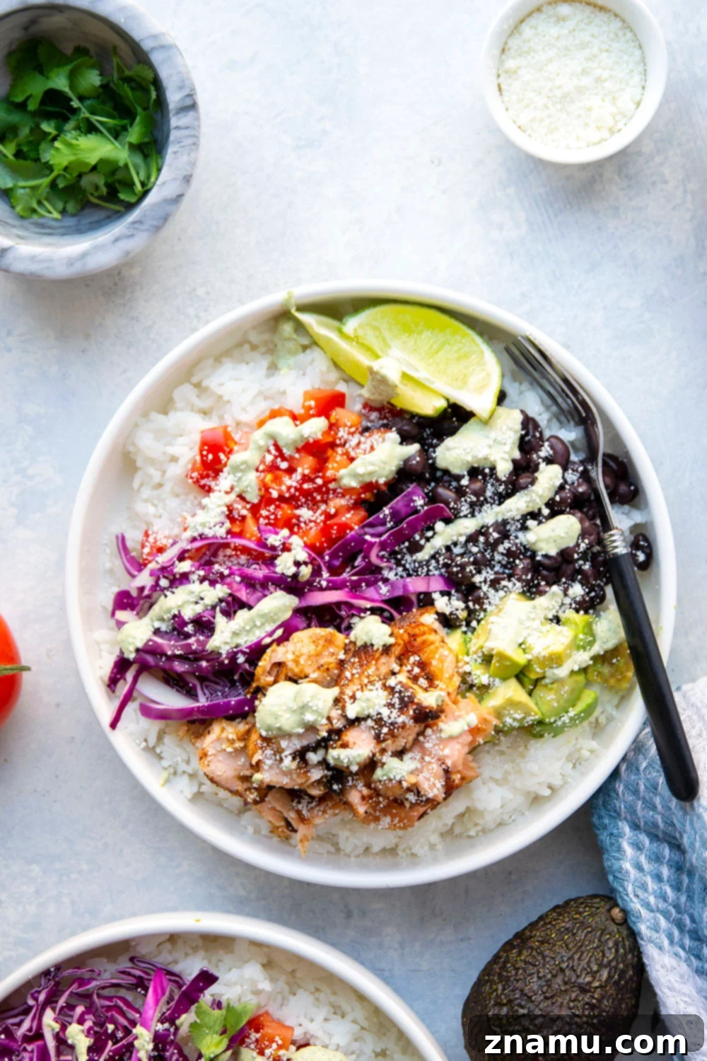Fiesta Salmon Taco Bowls 3 These salmon taco bowls feature everything you love about a fish taco in rice bowl form! Loaded with lots of spicy blackened salmon, hearty rice, a creamy tahini cilantro sauce, and all your favorite toppings.