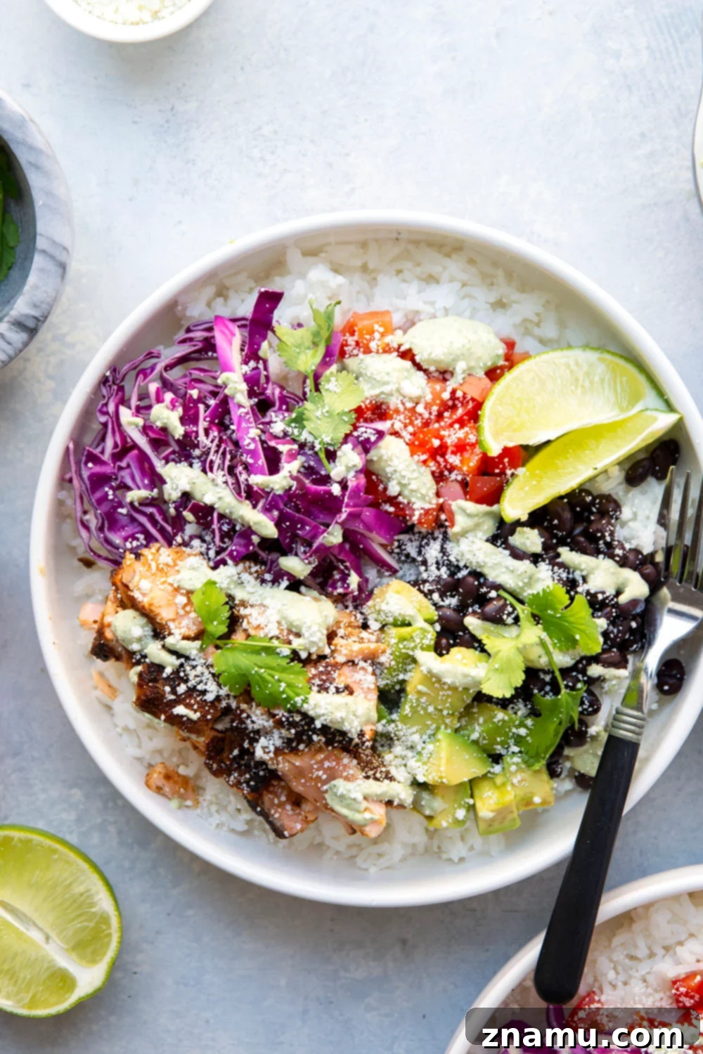 Fiesta Salmon Taco Bowls 5 These salmon taco bowls feature everything you love about a fish taco in rice bowl form! Loaded with lots of spicy blackened salmon, hearty rice, a creamy tahini cilantro sauce, and all your favorite toppings.