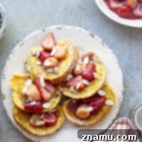Buttery Amaretto French Toast with caramelized strawberry banana sauce.