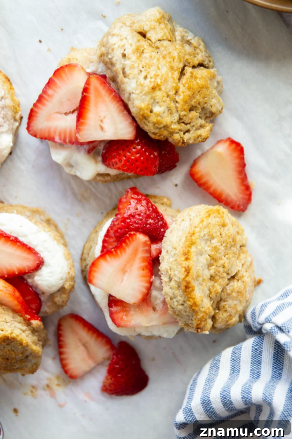 Rustic Whole Wheat Strawberry Shortcake 2 This whole wheat strawberry shortcake features rustic whole wheat biscuits cracked open warm and served with a sweet strawberry sauce and lots of fluffy whipped cream.