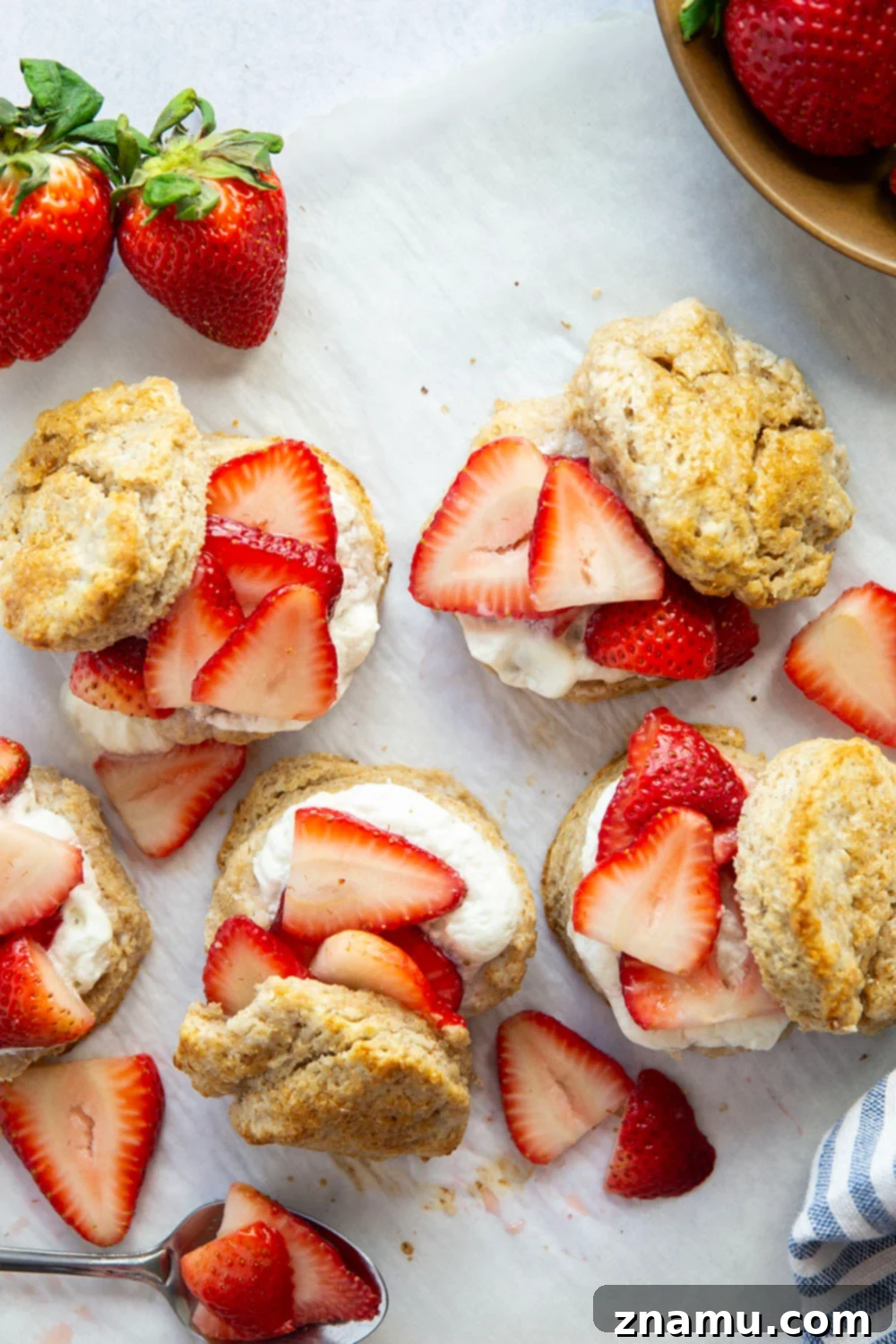 Rustic Whole Wheat Strawberry Shortcake 3 This whole wheat strawberry shortcake features rustic whole wheat biscuits cracked open warm and served with a sweet strawberry sauce and lots of fluffy whipped cream.