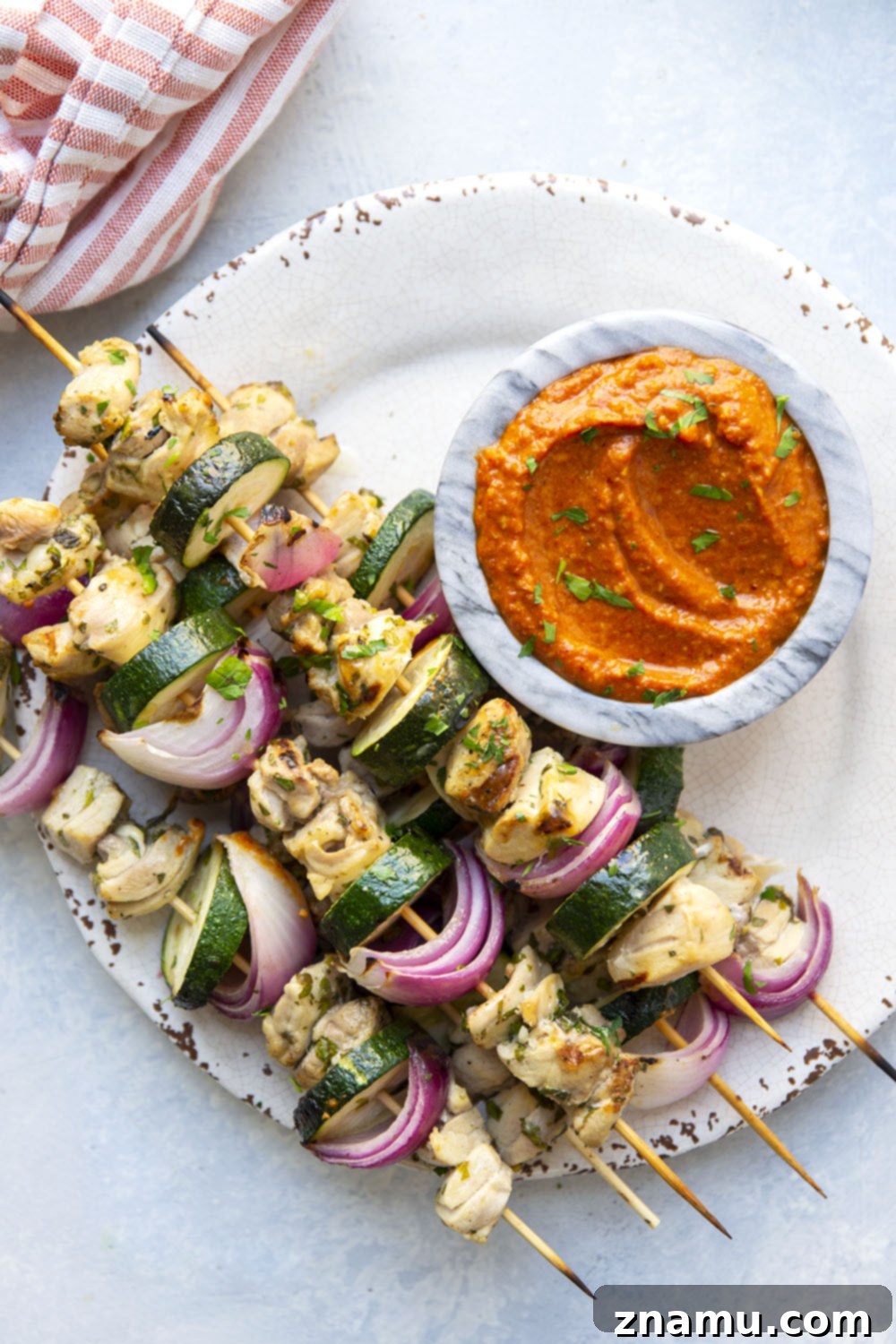 Sun-Kissed Chicken Skewers with Smoky Romesco 3 Close-up of Juicy Lemon Garlic Chicken Kabobs, showing the marinated chicken and grilled vegetables
