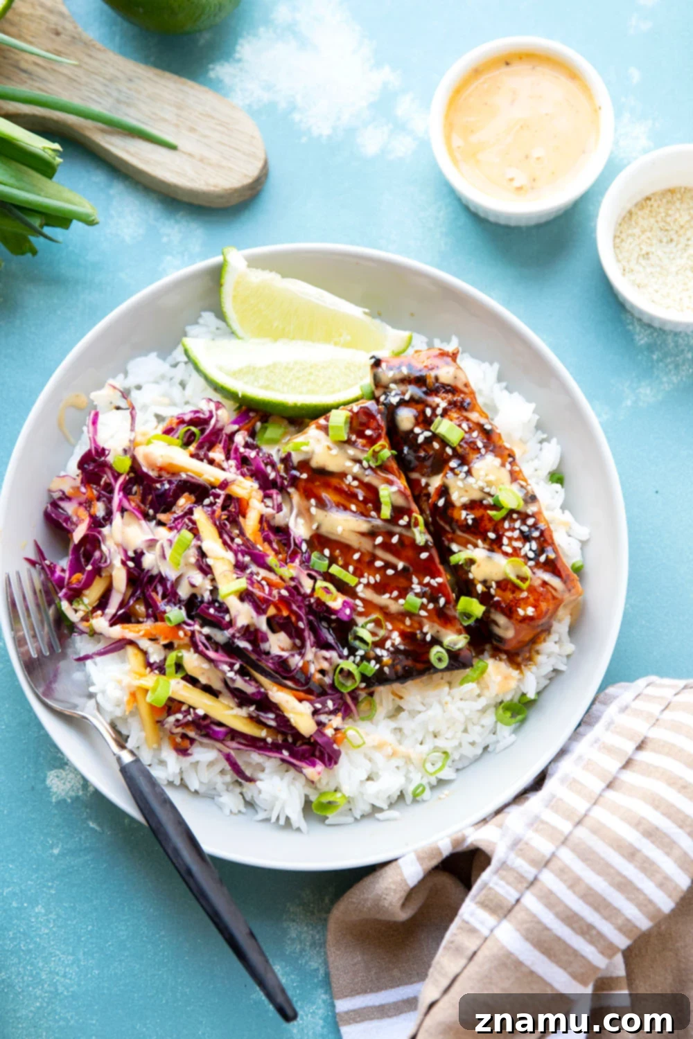 Sweet & Savory Teriyaki Salmon Bowls with a Zesty Mango Kick 2 These teriyaki salmon bowls feature smoky grilled salmon marinated in a flavorful homemade teriyaki sauce and served in rice bowls with lots of spicy mango slaw.