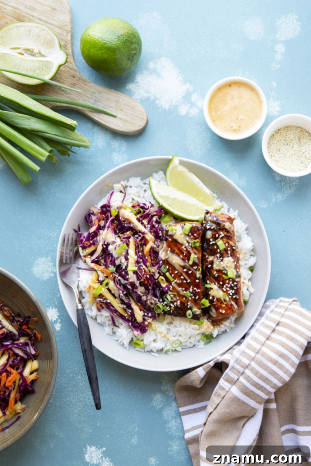 Sweet & Savory Teriyaki Salmon Bowls with a Zesty Mango Kick 3 These teriyaki salmon bowls feature smoky grilled salmon marinated in a flavorful homemade teriyaki sauce and served in rice bowls with lots of spicy mango slaw.