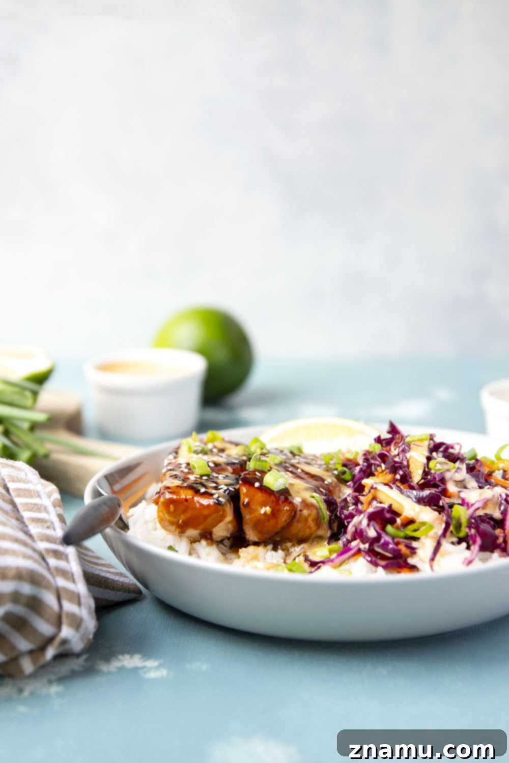 Sweet & Savory Teriyaki Salmon Bowls with a Zesty Mango Kick 4 These teriyaki salmon bowls feature smoky grilled salmon marinated in a flavorful homemade teriyaki sauce and served in rice bowls with lots of spicy mango slaw.