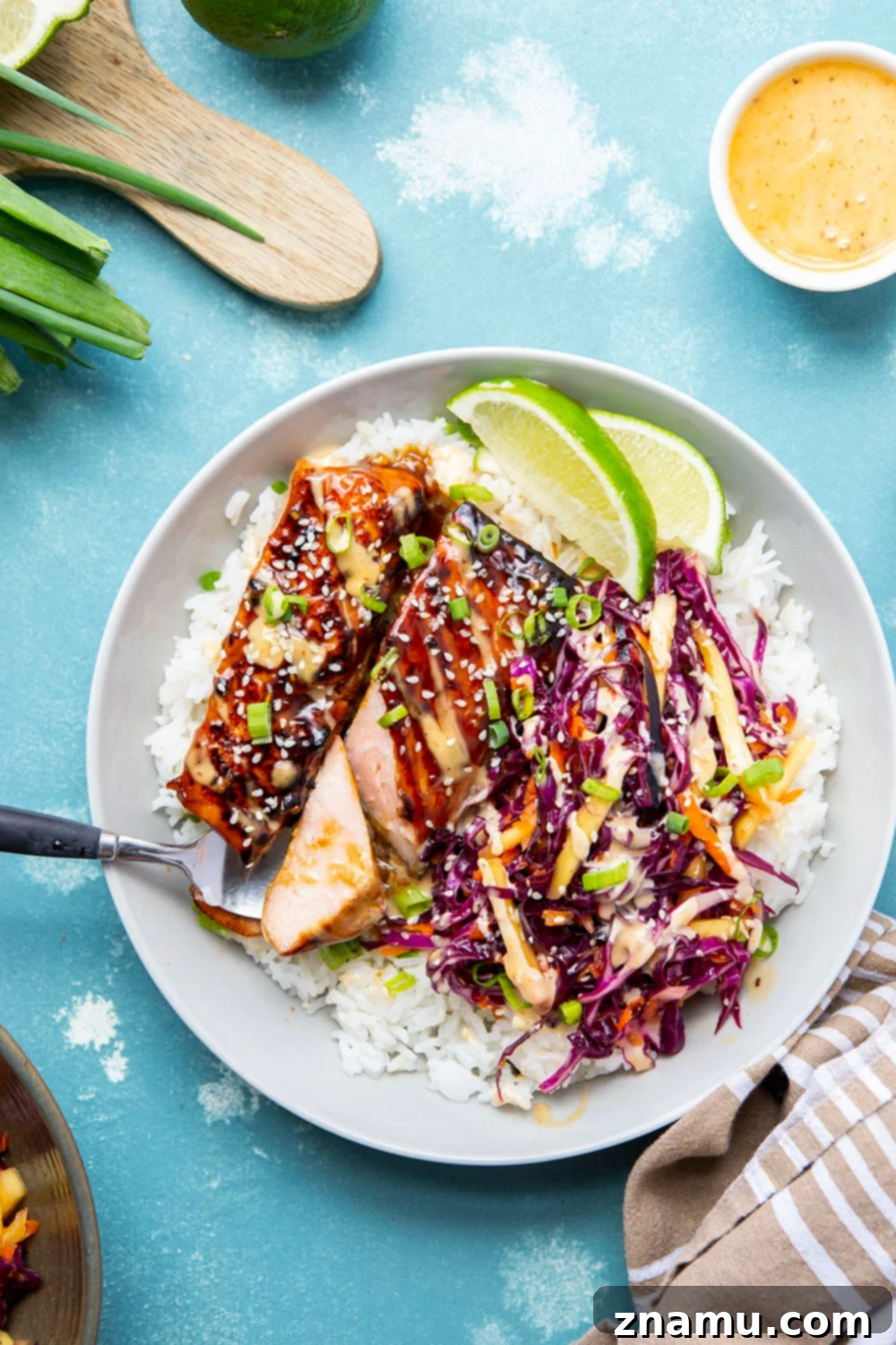 Sweet & Savory Teriyaki Salmon Bowls with a Zesty Mango Kick 5 These teriyaki salmon bowls feature smoky grilled salmon marinated in a flavorful homemade teriyaki sauce and served in rice bowls with lots of spicy mango slaw.