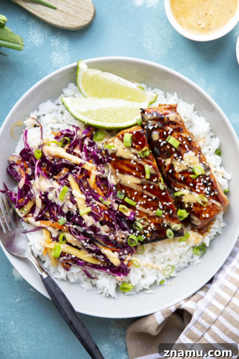 Sweet & Savory Teriyaki Salmon Bowls with a Zesty Mango Kick 6 These teriyaki salmon bowls feature smoky grilled salmon marinated in a flavorful homemade teriyaki sauce and served in rice bowls with lots of spicy mango slaw.