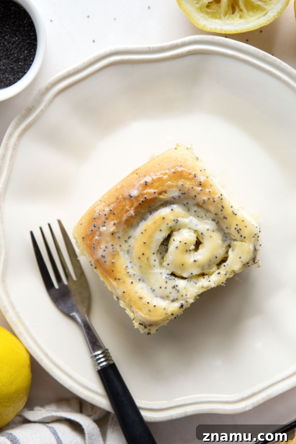 Glazed Lemon Poppy Seed Rolls 3 Soft, melt-in-your-mouth lemon poppyseed sweet rolls are speckled with pretty poppyseeds in every bite and glazed with a sweet and tangy fresh lemon icing.