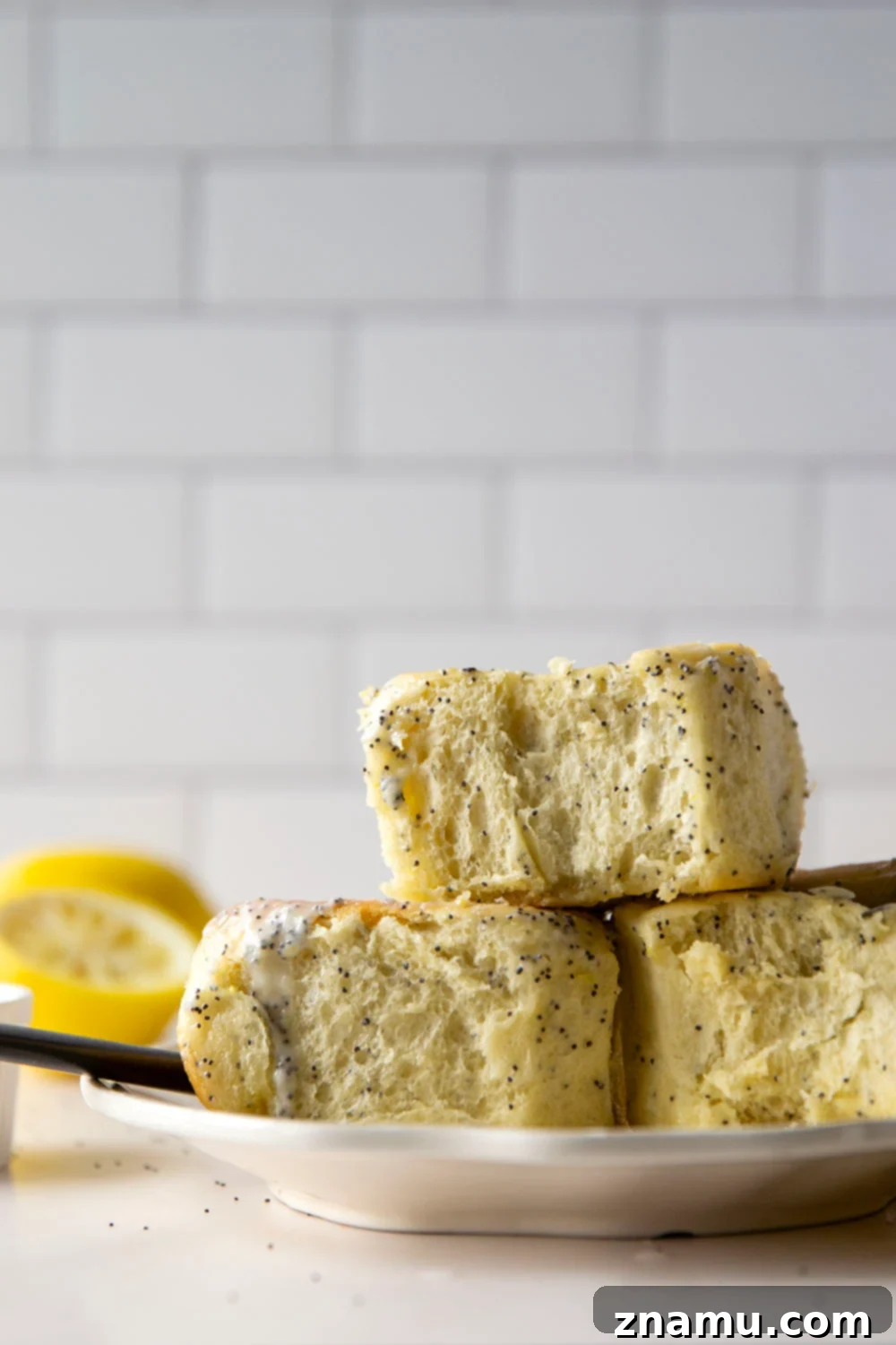 Glazed Lemon Poppy Seed Rolls 5 Soft, melt-in-your-mouth lemon poppyseed sweet rolls are speckled with pretty poppyseeds in every bite and glazed with a sweet and tangy fresh lemon icing.