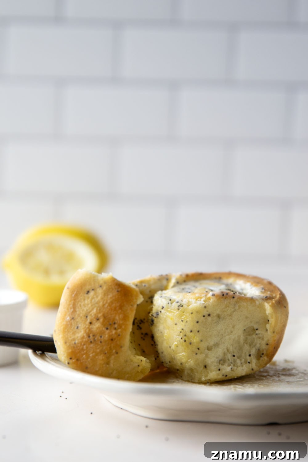 Glazed Lemon Poppy Seed Rolls 6 Soft, melt-in-your-mouth lemon poppyseed sweet rolls are speckled with pretty poppyseeds in every bite and glazed with a sweet and tangy fresh lemon icing.