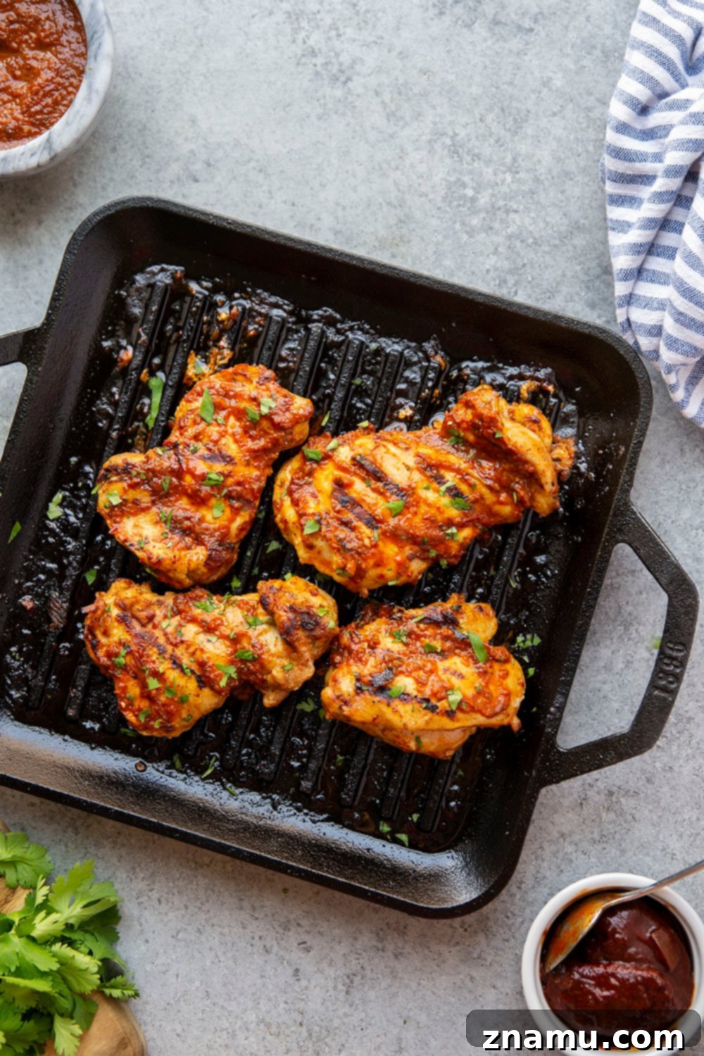 Smoky Chipotle Grilled Chicken Thighs 2 Grilled Chipotle Marinated Chicken Thighs - tender, smoky, and spicy perfection.