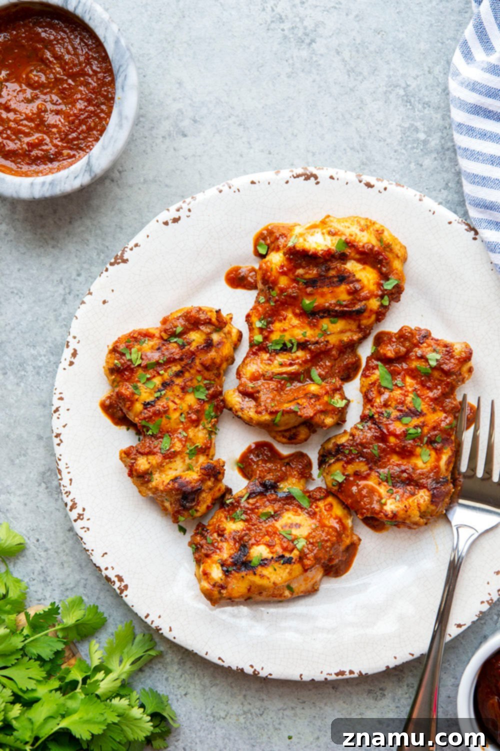 Smoky Chipotle Grilled Chicken Thighs 6 Grilled chipotle chicken served with cilantro.