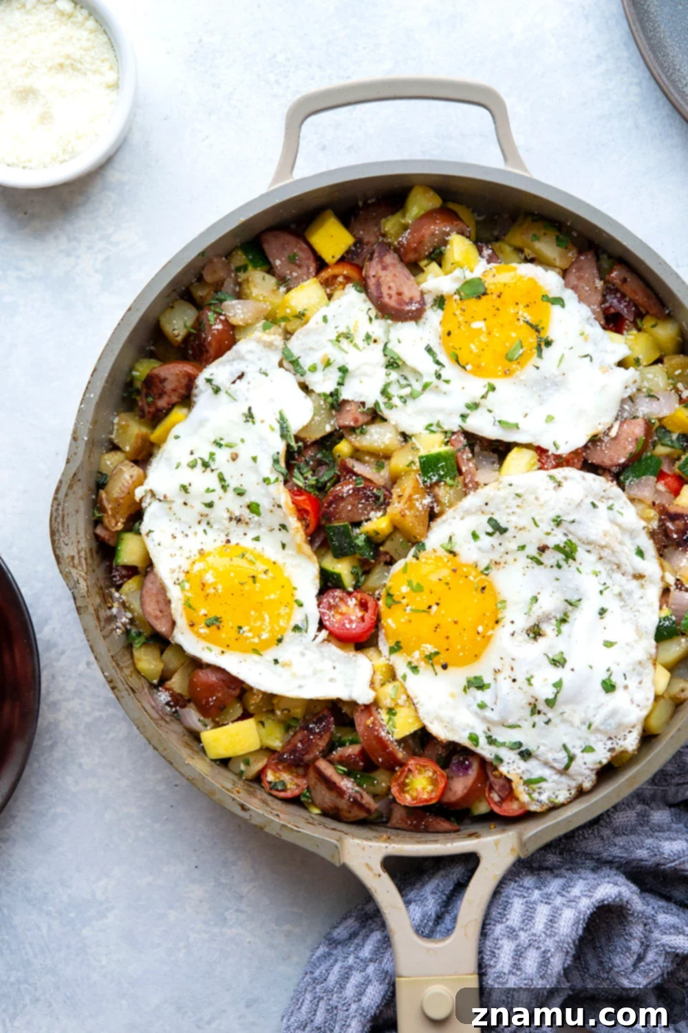 Summer Harvest Sausage Hash 3 This sausage breakfast hash is loaded with a rainbow of fresh summer vegetables, crispy potatoes, and lots of flavorful sausage. - the best savory summer breakfast with an egg served on top!