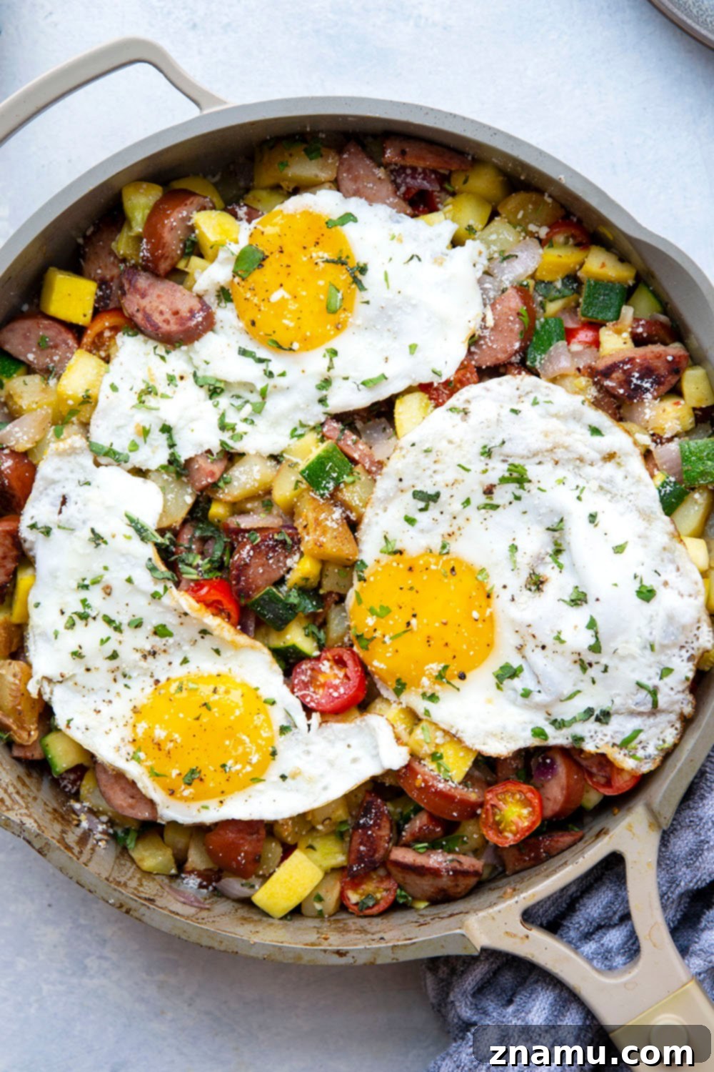 Summer Harvest Sausage Hash 5 This sausage breakfast hash is loaded with a rainbow of fresh summer vegetables, crispy potatoes, and lots of flavorful sausage. - the best savory summer breakfast with an egg served on top!