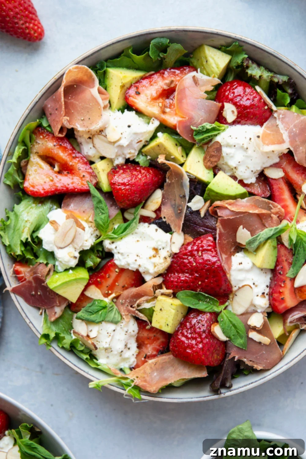 Packed with juicy marinated strawberries, salty prosciutto, and creamy burrata, this strawberry burrata salad is the prettiest summer meal and ready in just minutes!