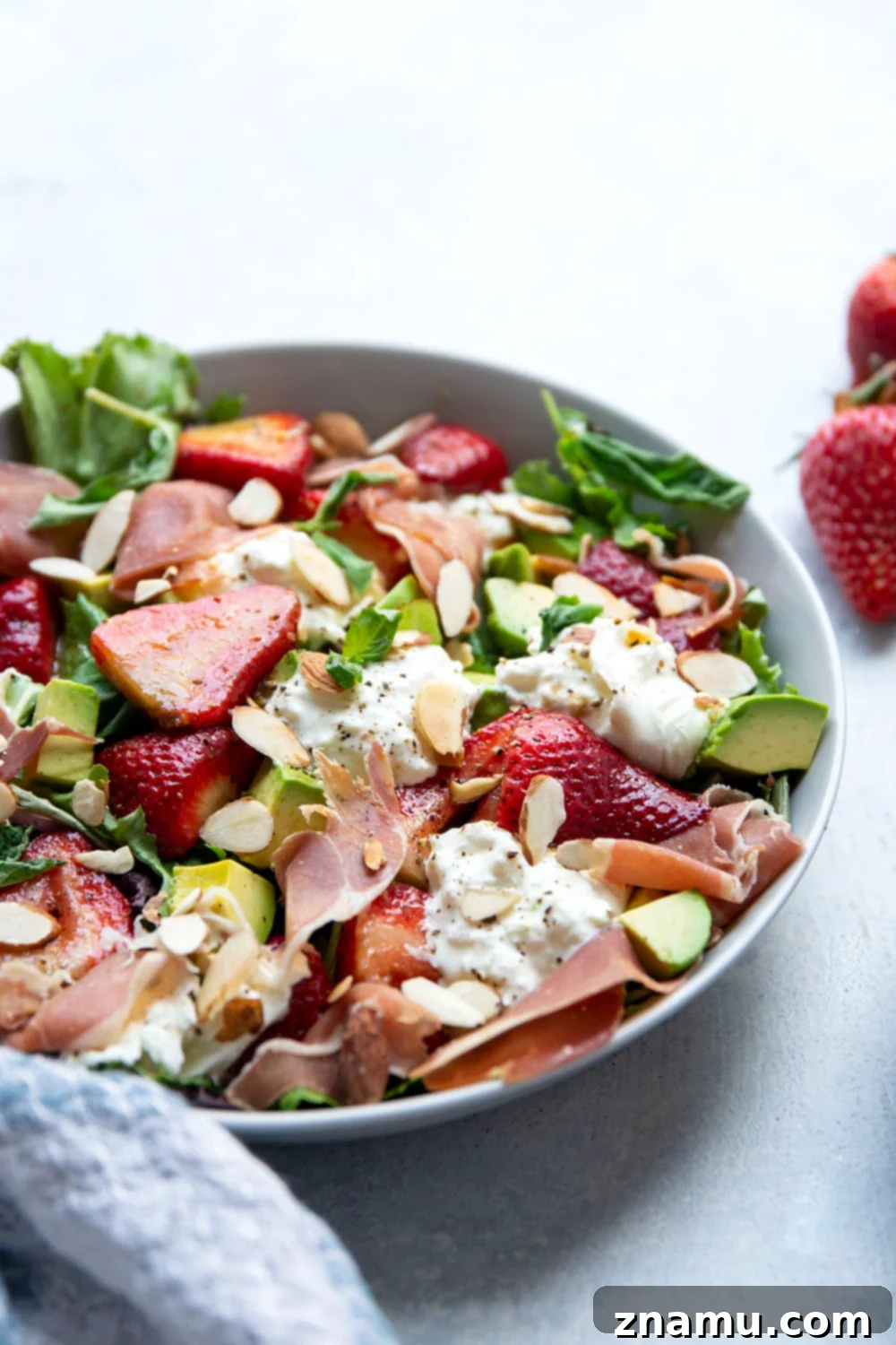 Packed with juicy marinated strawberries, salty prosciutto, and creamy burrata, this strawberry burrata salad is the prettiest summer meal and ready in just minutes!