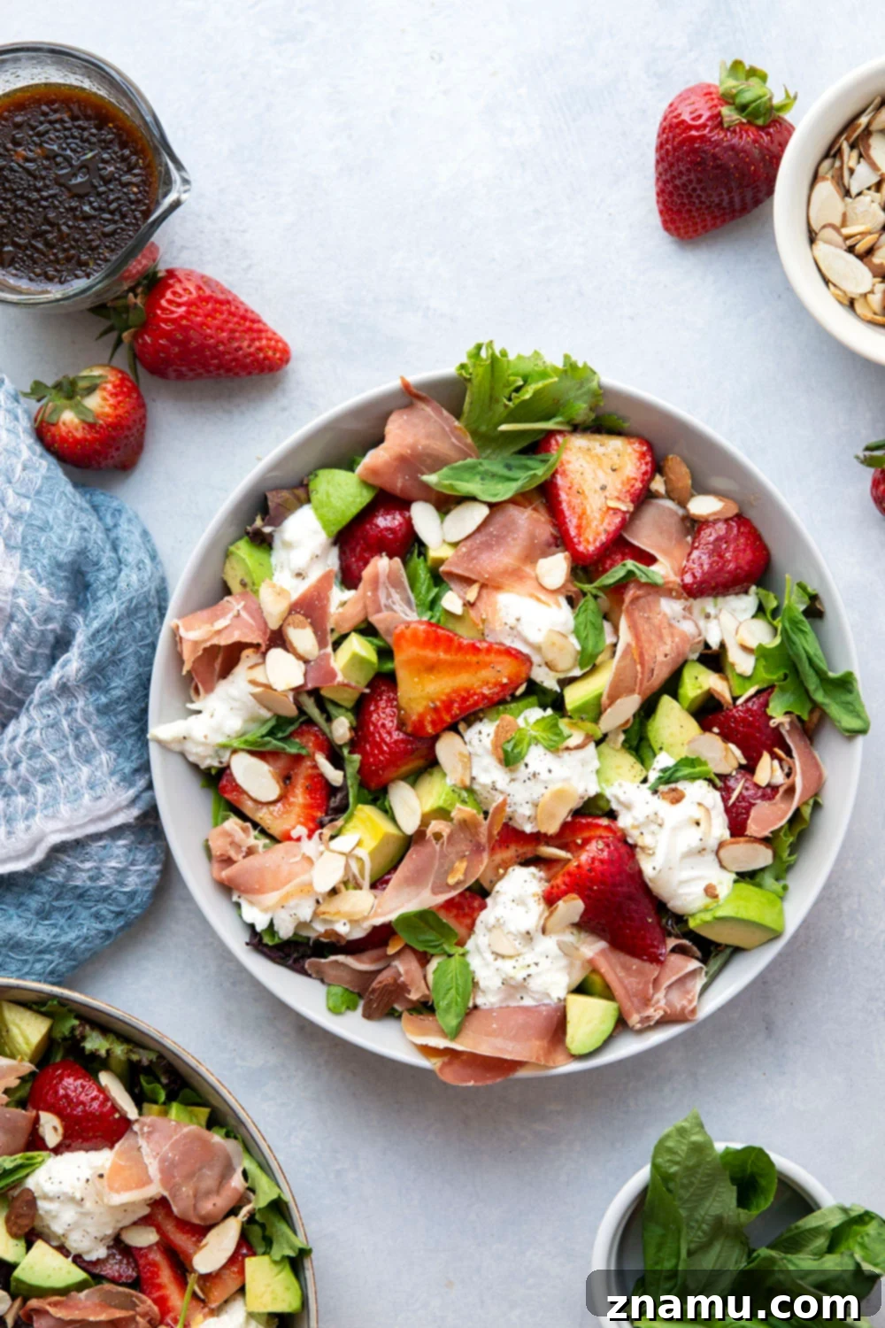 Packed with juicy marinated strawberries, salty prosciutto, and creamy burrata, this strawberry burrata salad is the prettiest summer meal and ready in just minutes!